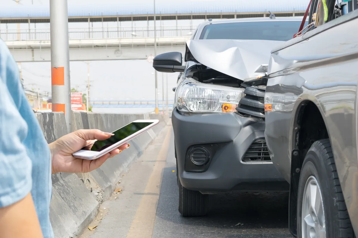 Image of a gray sedan that rear-ended a gray truck