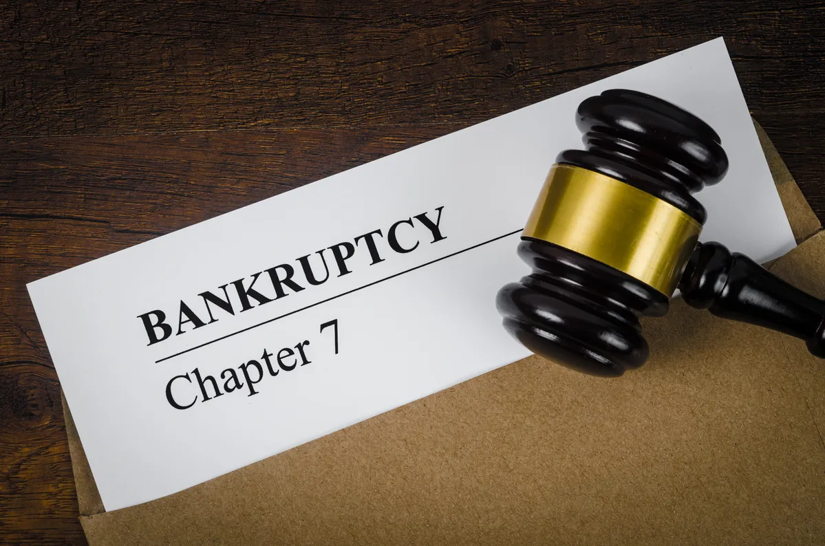 Image of a man checking his credit score to show the effect of bankruptcy on credit score.