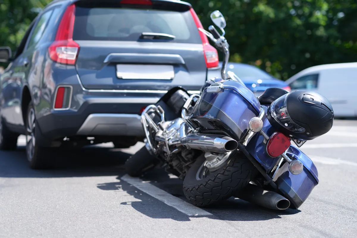 Image of a motorcycle after hitting a sedan
