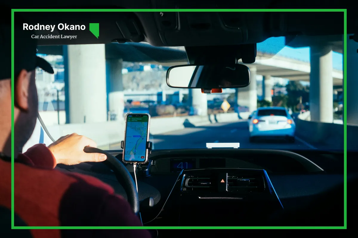 Image of a rideshare driving, transporting a passenger in a city