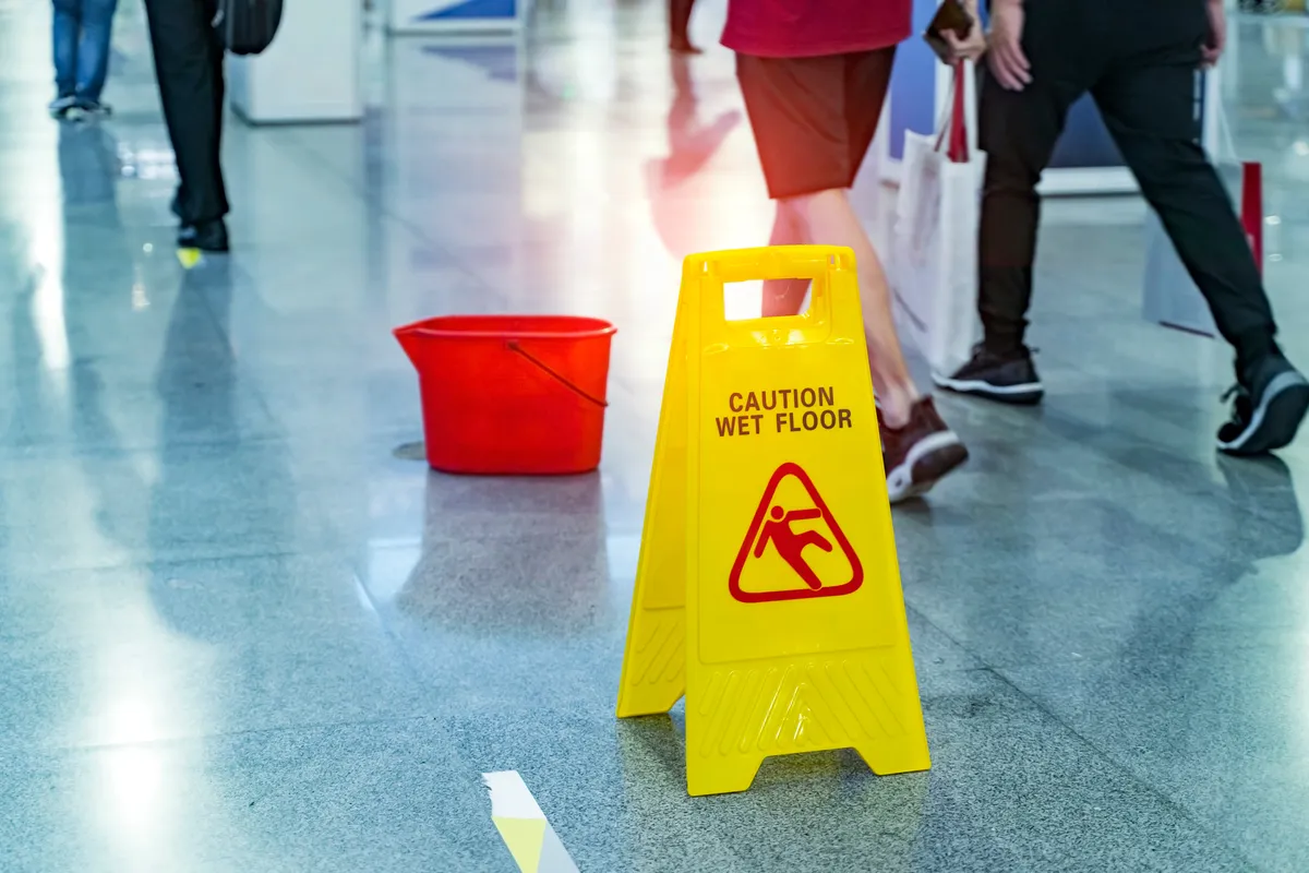 Image of a wet floor sign meant to prevent slips and falls.