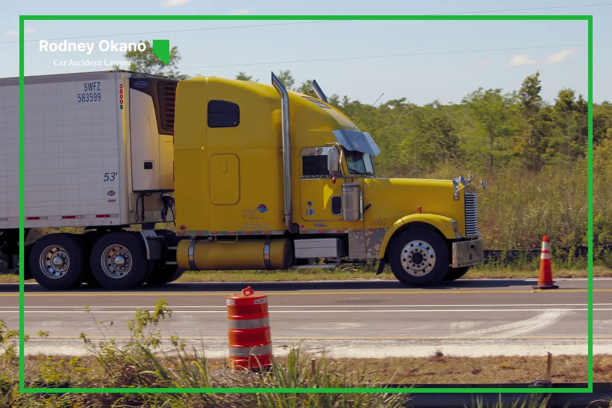 Image of a yellow truck on the road after an accident