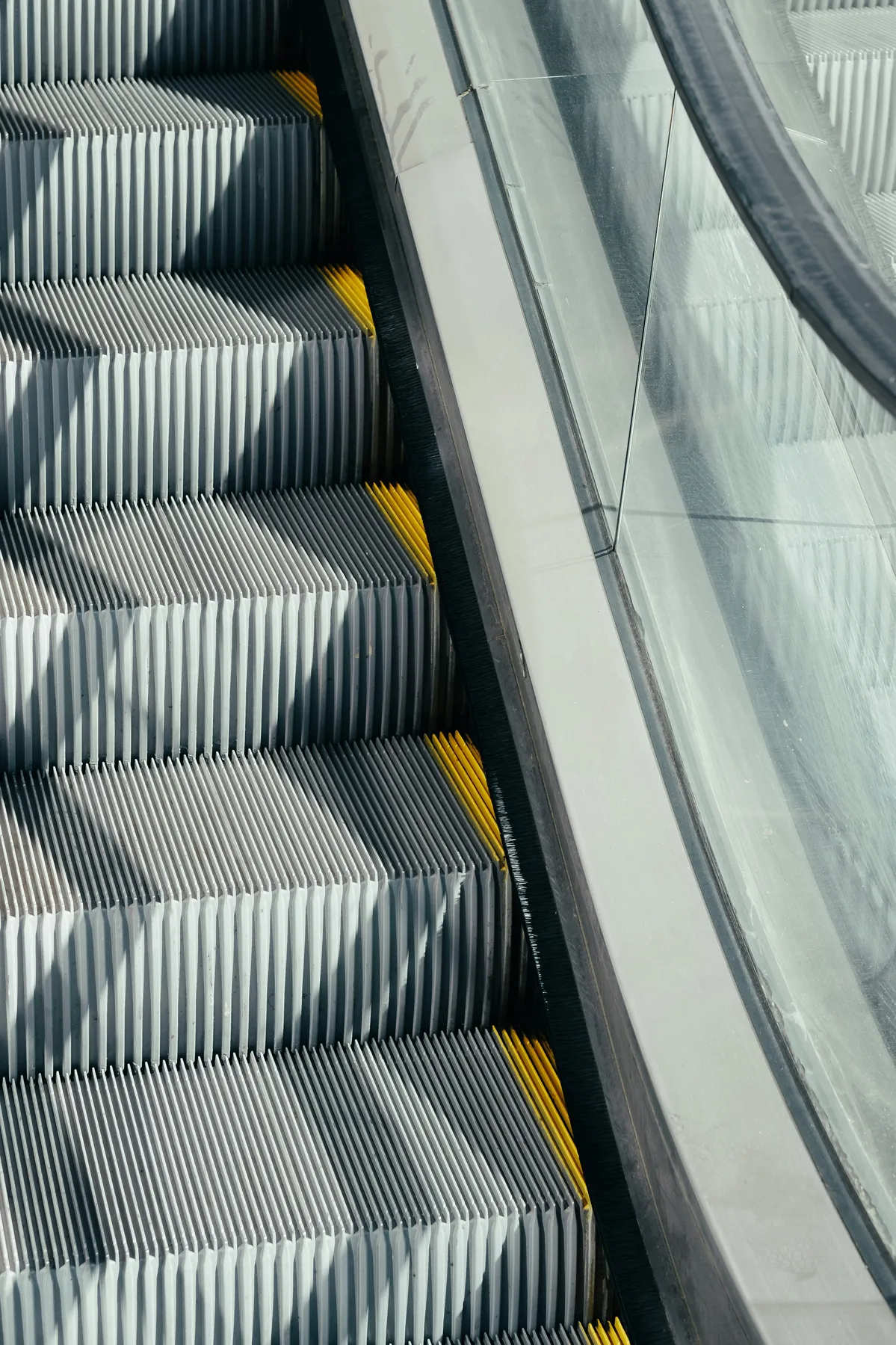 Image of an escalator to represent the risk of tripping on them.