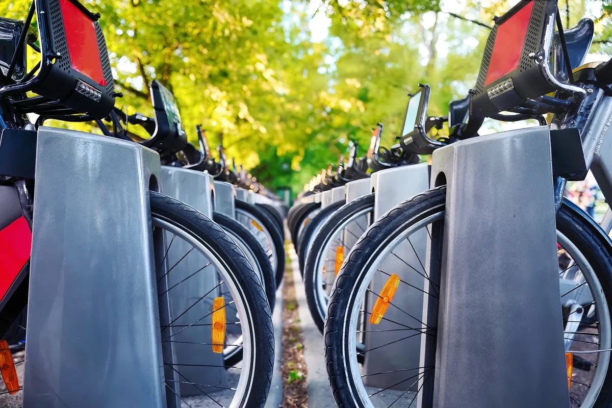 Image of two rows of electric bikes parked