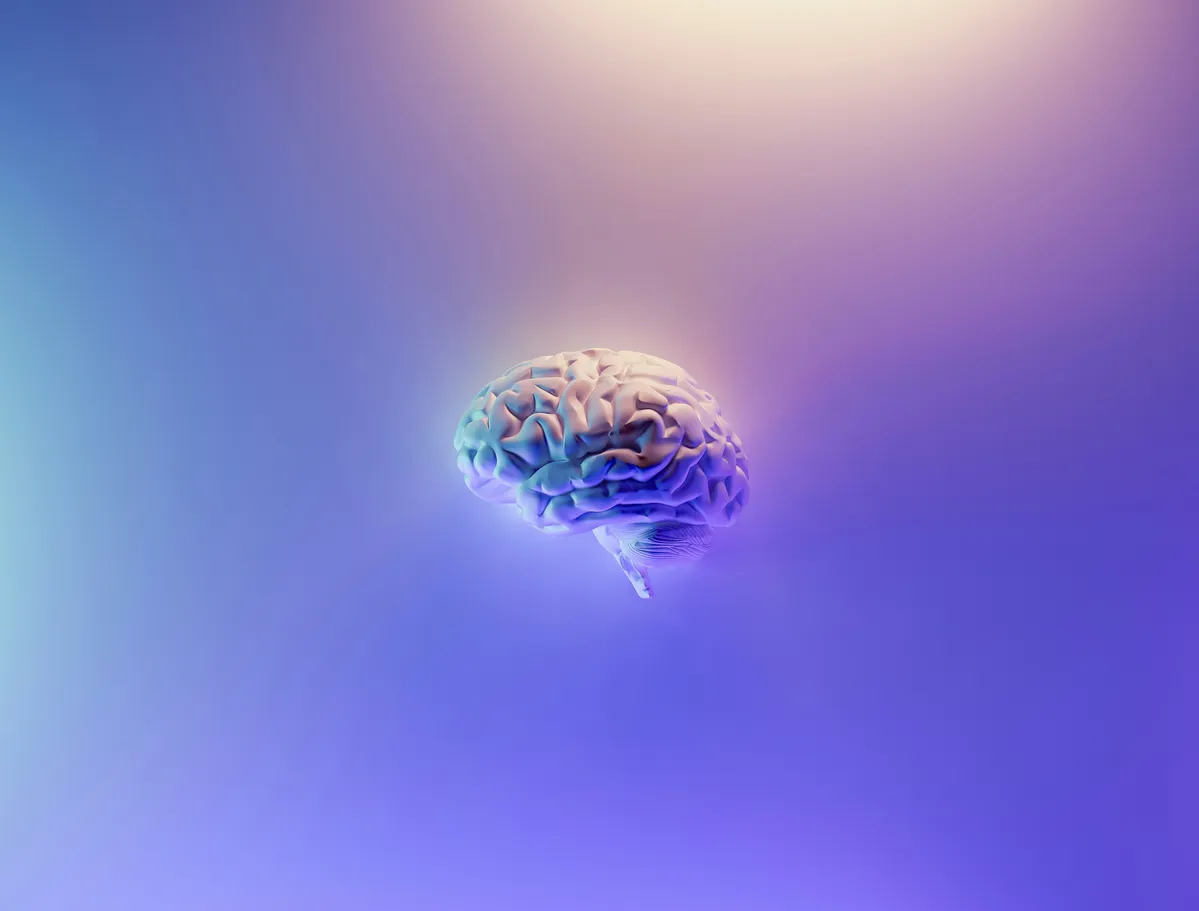  a brain that is in the middle of a blurry background