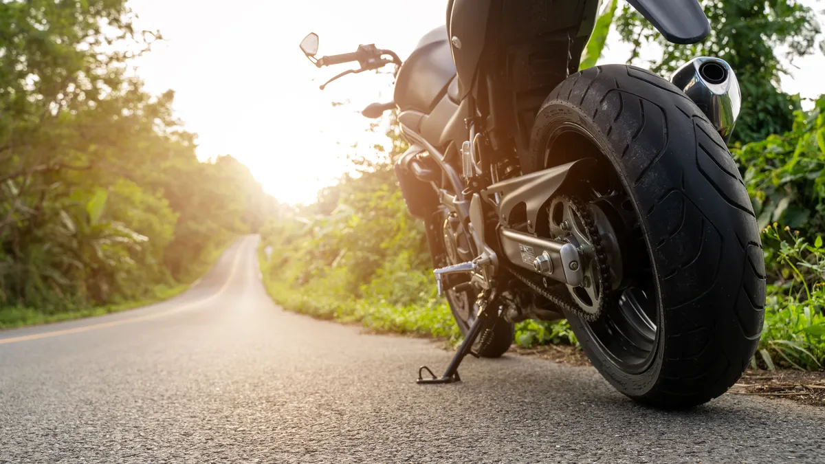  a motorcycle parked on the side of the road