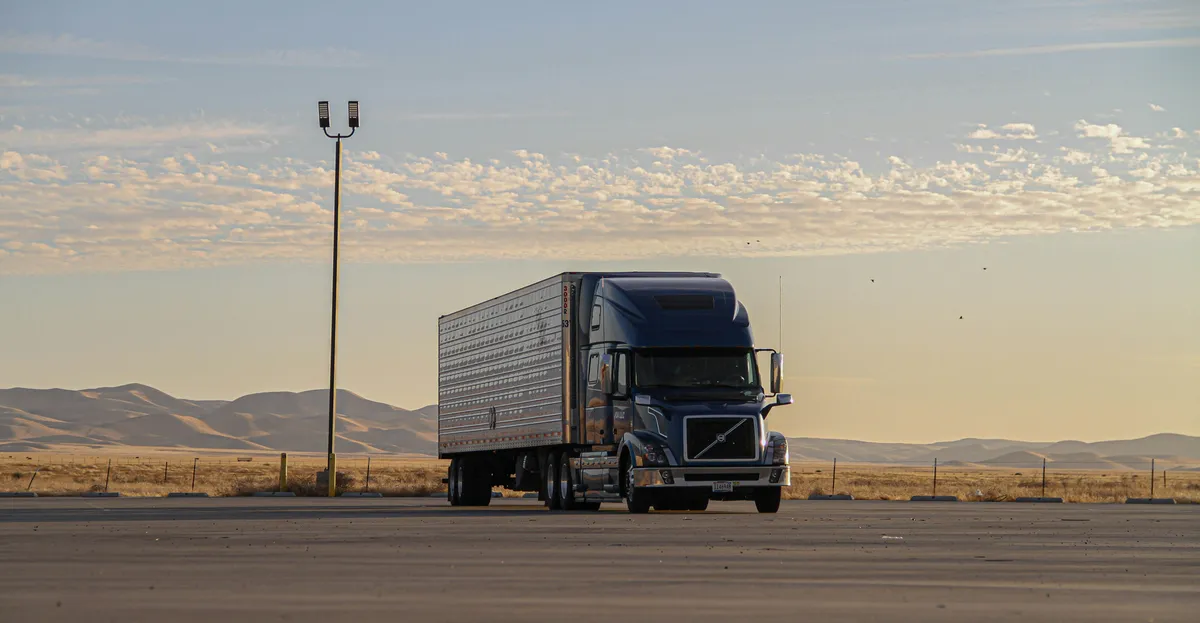 a semi truck that is driving down the road