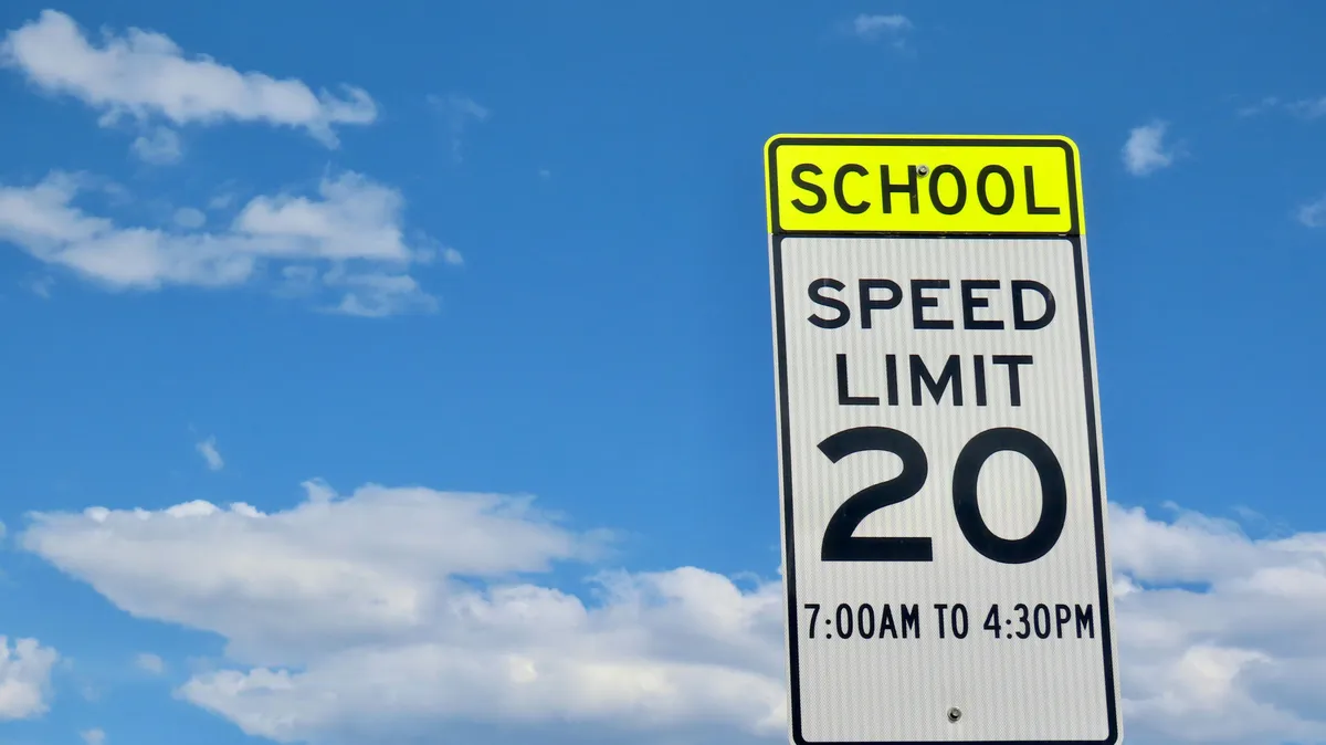 arafed speed limit sign with a sky background and clouds
