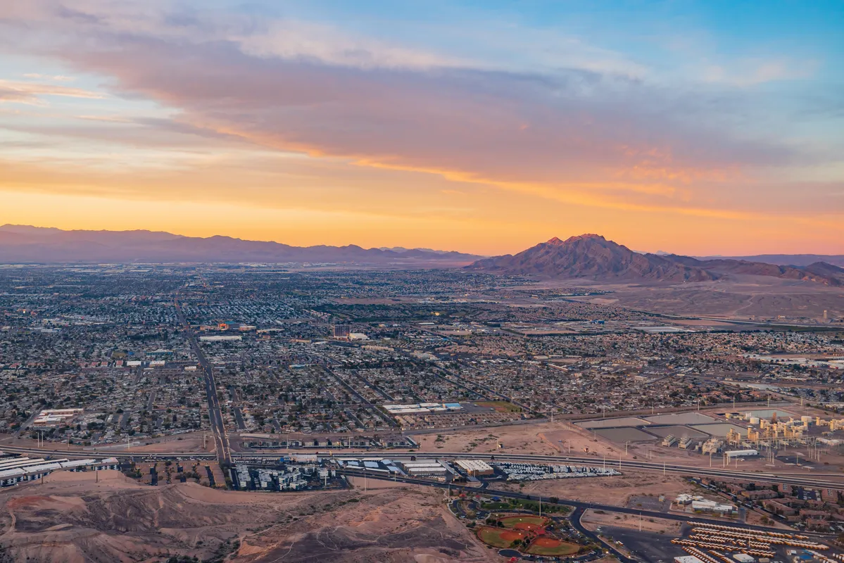 arafed view of a city with a mountain in the background