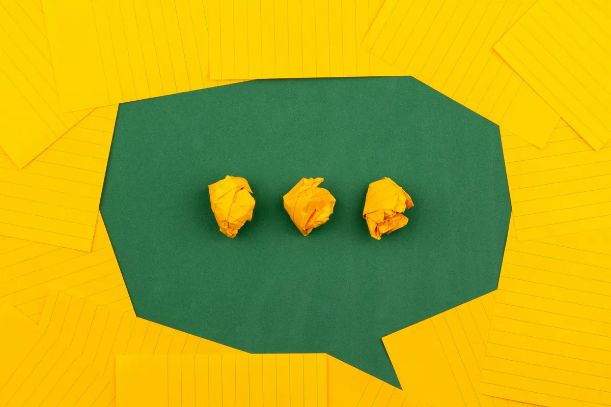  three pieces of paper that are in a speech bubble