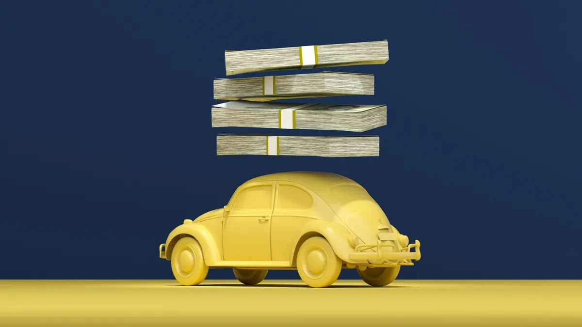yellow car with stacks of money on top of it